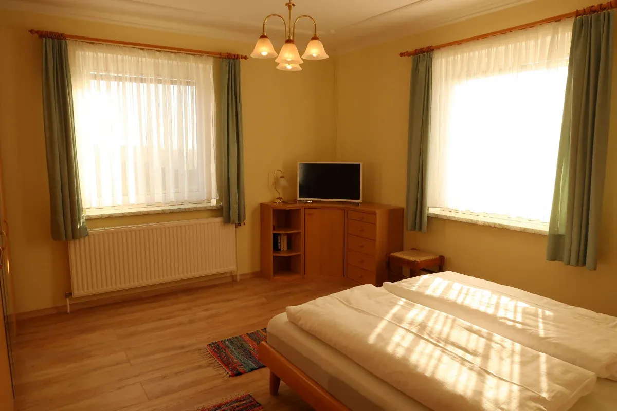 Bedroom with double bed and natural daylight